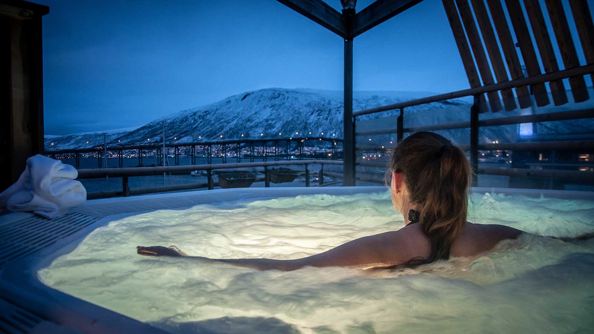 woman in a hot tub overseeing the night life