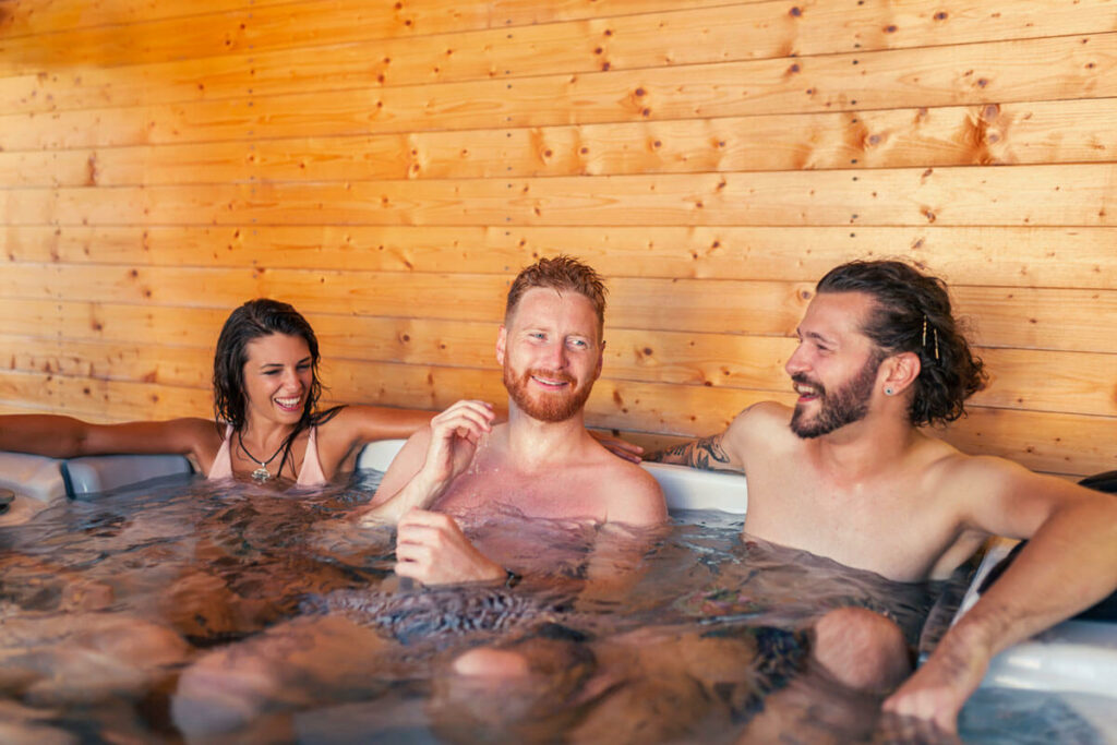 Girl friends relaxing in a hot tub while on a vacation