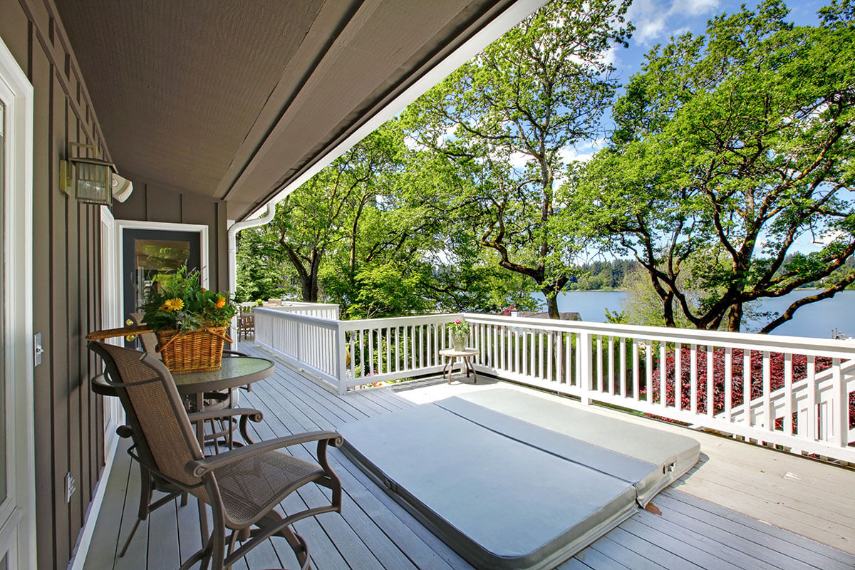 Large long balcony home exterior with hot tub