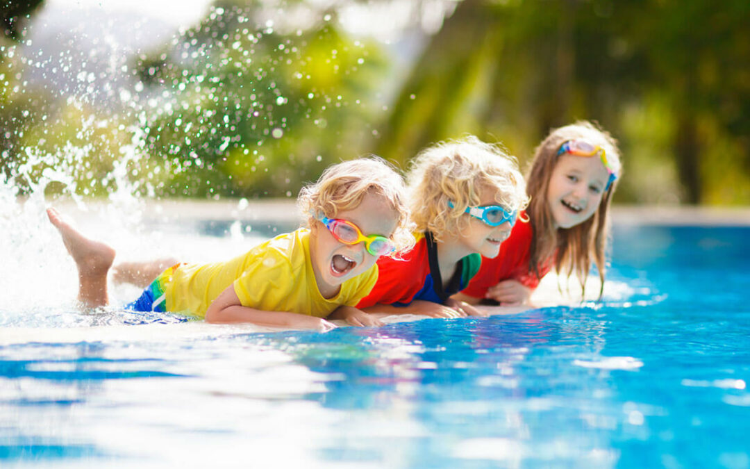 children swimming at the pool