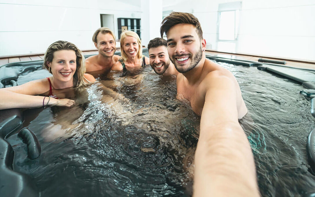 friends taking selfie while doing jacuzzi