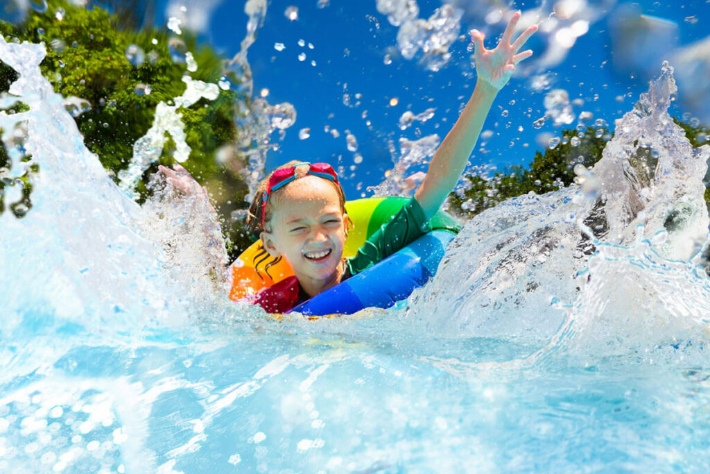 kid swimming at the pool